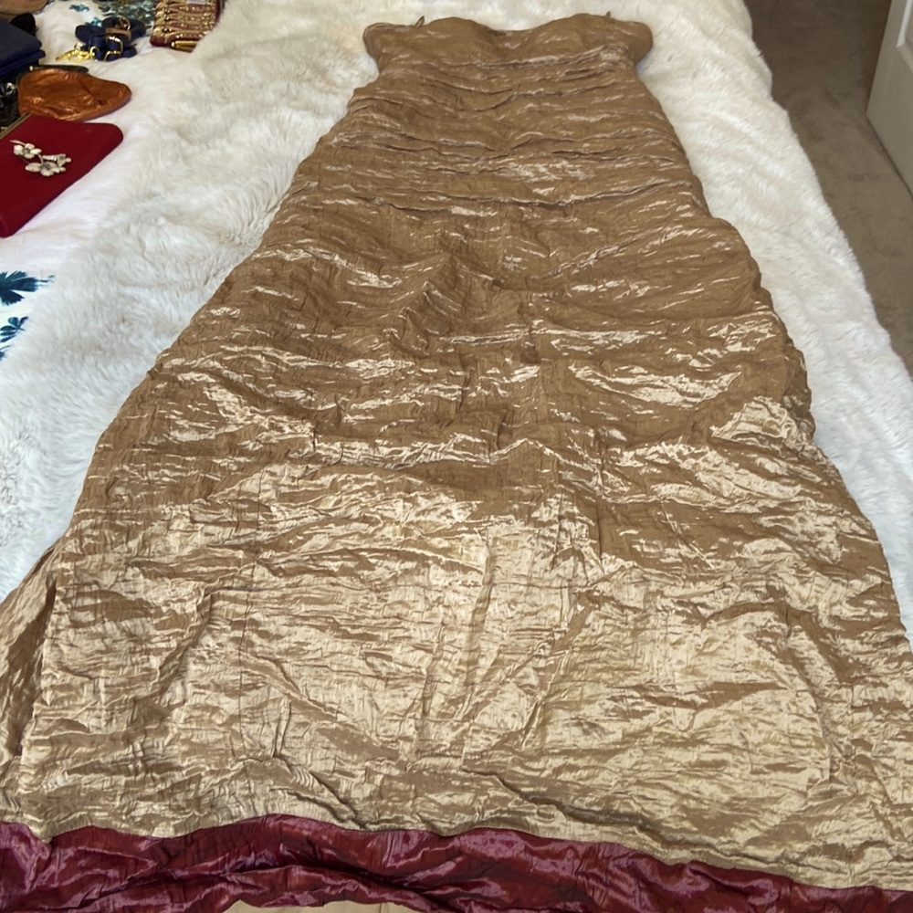 Stunning Nicole Miller full length gold metallic ruched gown w/ burgundy trim.